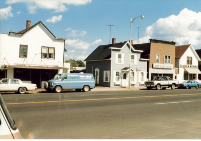 Old buildings with old cars lining the street