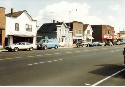 Old buildings with old cars lining the street